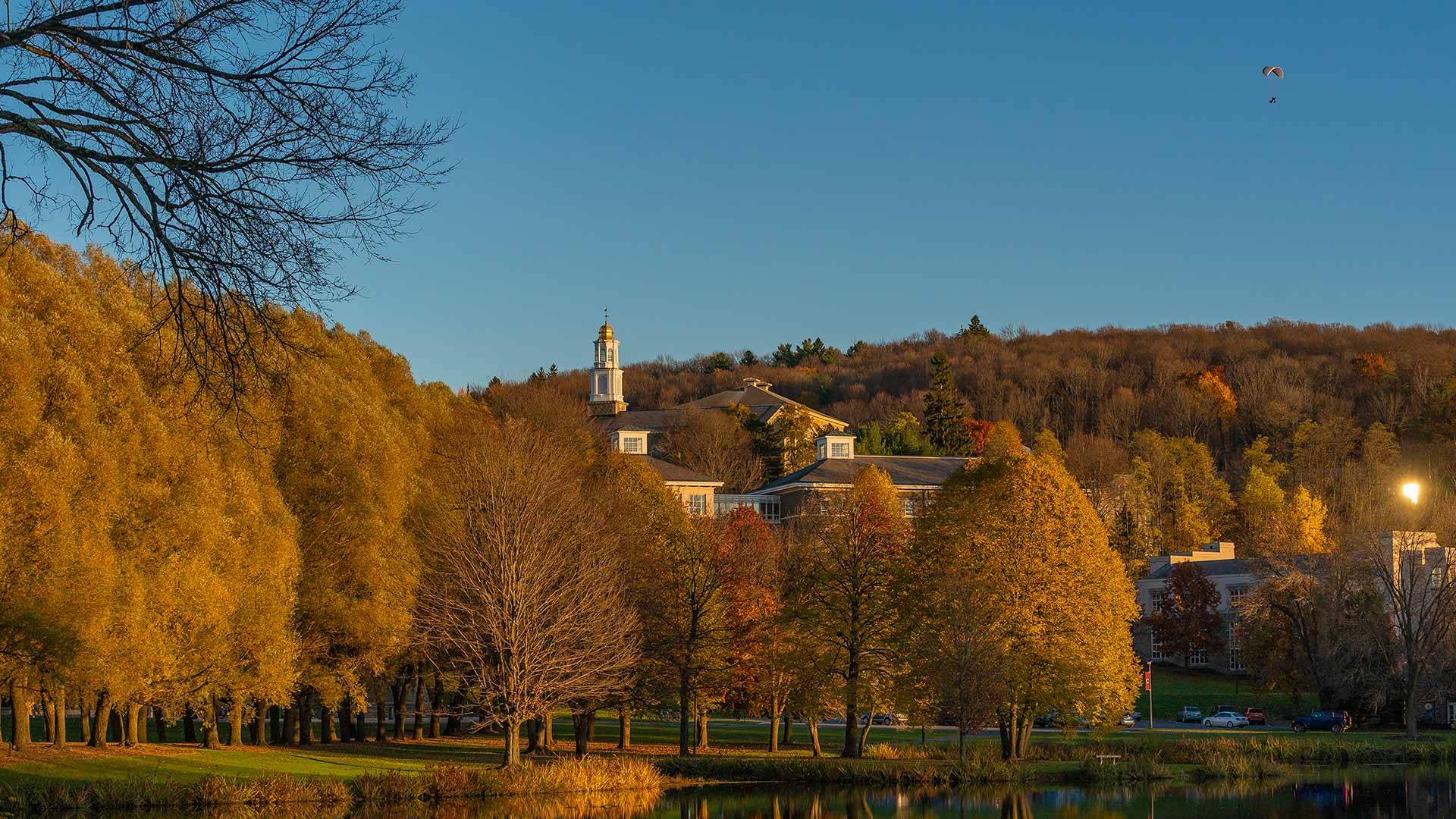 A scenic view of the campus over Taylor Lake with the Memorial Chapel cupola in the background.